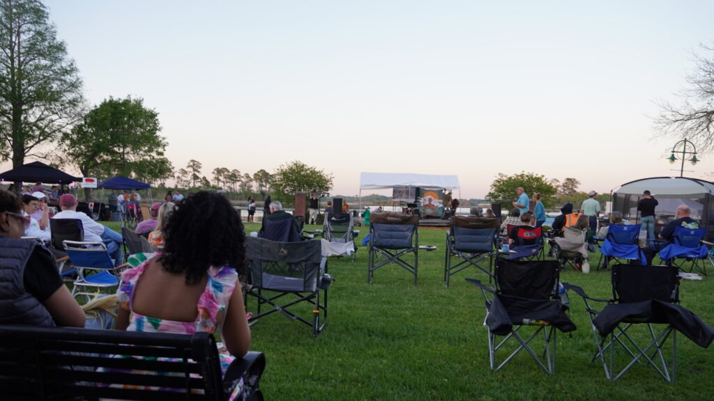 A riverfront concert at dusk on the Moss Point riverfront