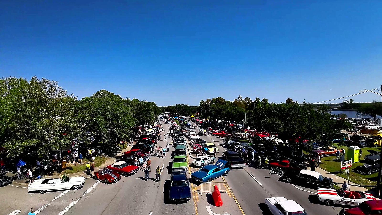 Aerial view down Main Street lined end to end with classic cars and crowds