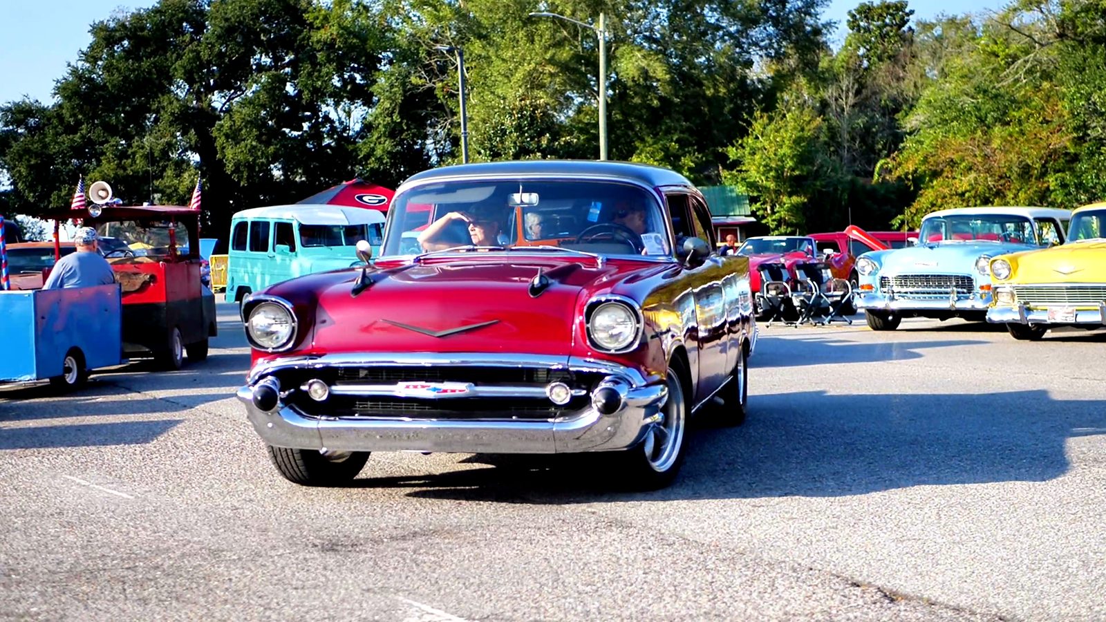 A two-tone 1957 Chevrolet rolling through the show