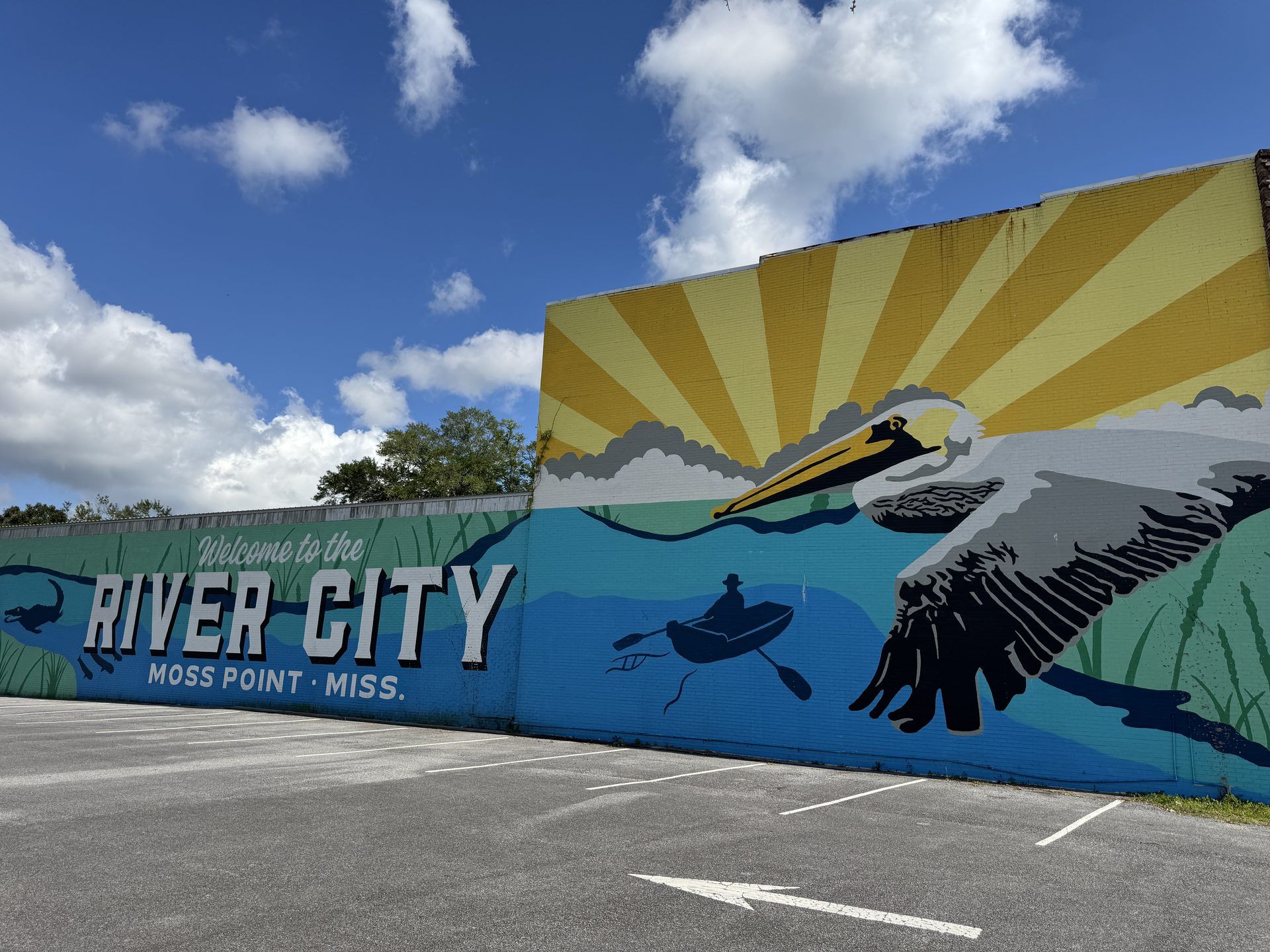 The “Welcome to the River City” mural in downtown Moss Point, with a flying pelican over the words Moss Point, Miss.